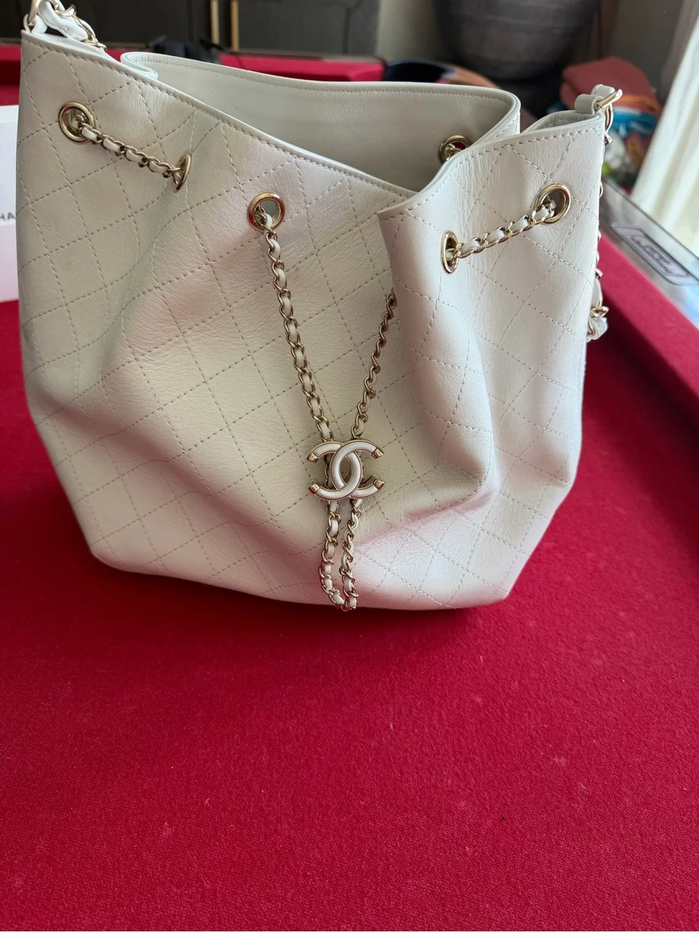 CHANEL Cream Quilted Drawstring Bucket Bag with Gold Chain